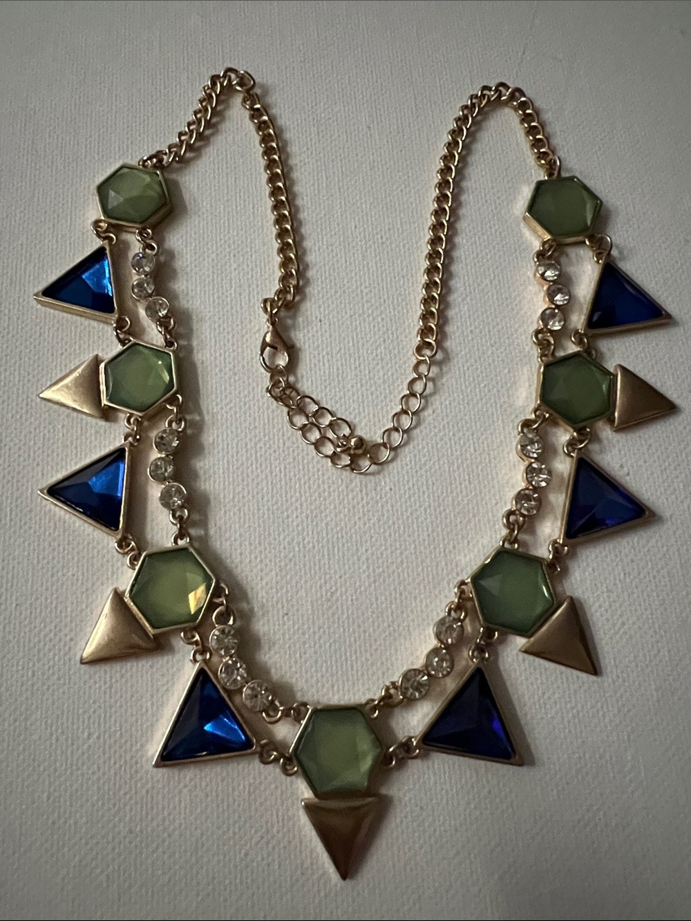 Gold-Tone Necklace with Olive Green Hex and Sapphire Blue Triangles